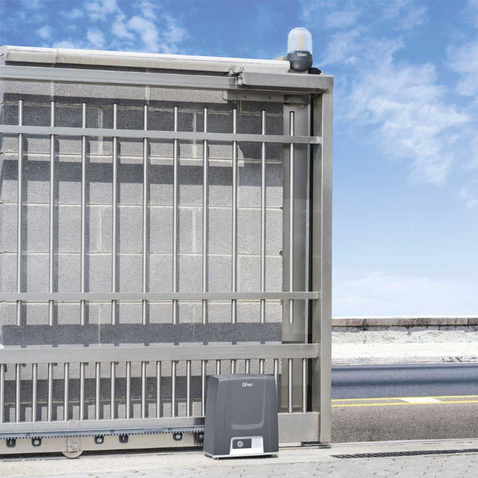 Automated gate system with a control panel on a clear day